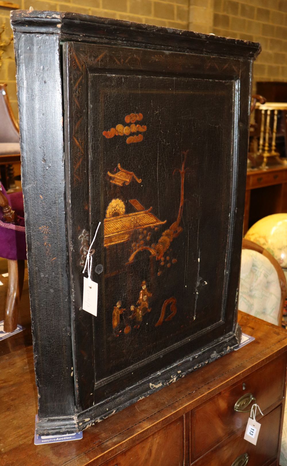 A George III chinoiserie lacquered hanging corner cabinet, W.63cm, D.35cm, H.78cm